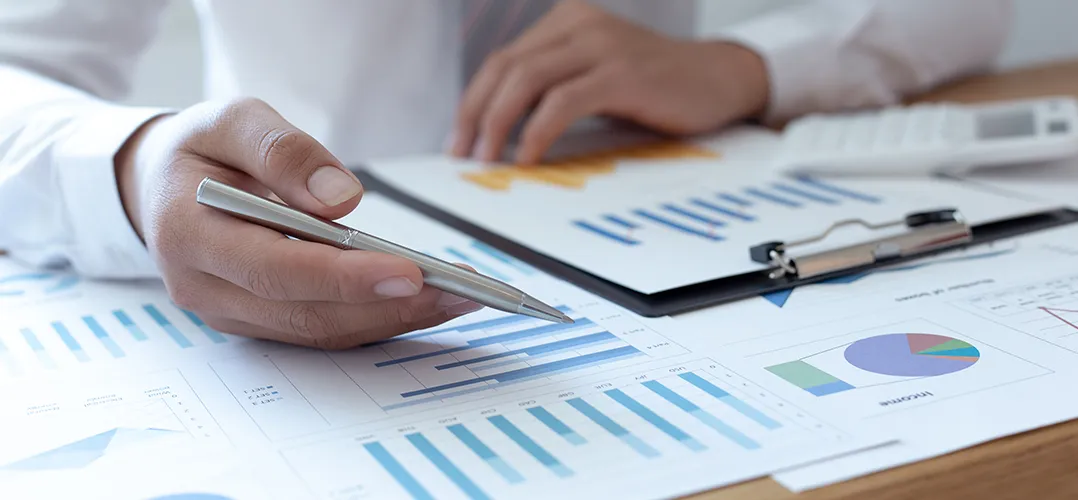 Man showing documents and graphs